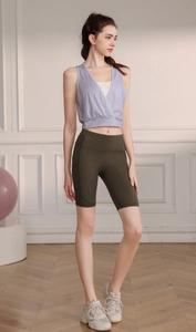 Pale purple mesh yoga vest paired with olive green cycling shorts for fitness training