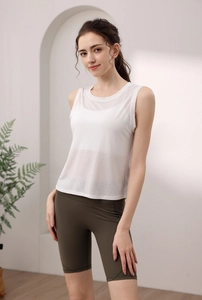Macro detail of breathable white tencel yoga tank top paired with olive green bike shorts