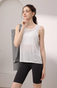 Detail of breathable white tencel yoga tank top with sheer texture and matching shorts