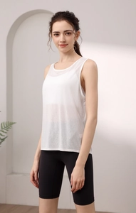 Close-up of white breathable mesh Tencel tank top and high-waisted black yoga shorts