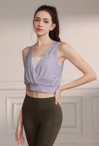 Detail of lavender V-neck sports vest with breathable mesh texture and olive yoga pants
