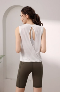Detail of the backless white sports vest showing cross-strap design and open back