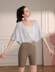 Detailed view of white jacquard nylon sports vest with loose-fitting batwing sleeves