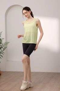 Close-up of lightweight light green yoga tank top with breathable mesh texture
