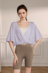 Detail of light purple jacquard batwing sleeve yoga cover-up with knitted texture