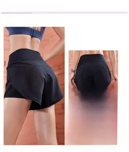 Detail view of high-waist sports shorts with arched hem and moisture-wicking fabric