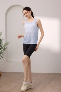 Light blue tencel sports tank top with breathable fabric shown in a modern home setting