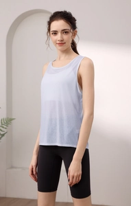 Detail of light blue semi-transparent yoga tank top with breathable tencel fabric