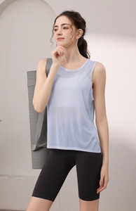 Detail of light blue mesh yoga tank top showing breathable fabric texture and relaxed fit
