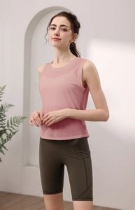Detail of dry rose pink breathable mesh tank top with olive green high-waisted shorts