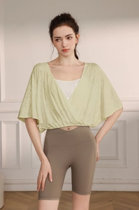 Detailed texture of jacquard batwing sleeve yoga cover-up with breathable mesh fabric