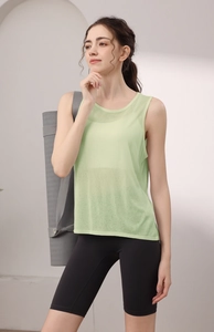 Close-up of lightweight tencel racerback yoga tank top paired with black biker shorts