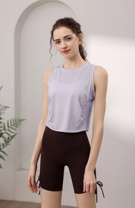Detail of lavender layered tencel sports tank with side drawstrings and mesh texture