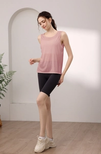 Minimalist rose pink tencel sports tank top and black high waist cycling shorts for women