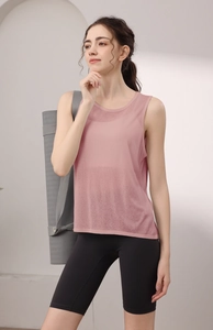 Detailed texture of pink breathable mesh yoga tank top and black cycling shorts