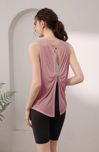 Detail of cross-back twist design on a rose pink Tencel yoga tank top for women