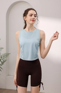 Detail of light blue tencel yoga tank top and brown high waist drawstring shorts set