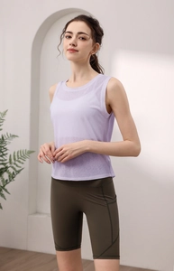 Detail of lavender tencel backless yoga vest paired with dark olive green biker shorts