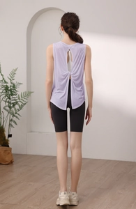 Close-up of lavender gym tank top featuring back cross knot and breathable cutout design