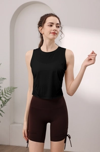 Detail of slim-fit yoga top with round neck and side drawstring biker shorts