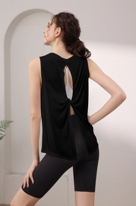 Detail of black backless yoga tank top with unique twist knot and open back design