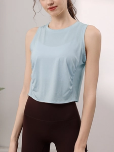 Slim fit light blue Tencel yoga tank top with side ruching and a crew neck design