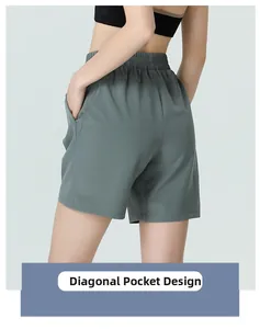 Detail view of high waisted sports shorts with functional slanted side pocket design