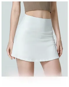 Close-up of white high-waisted athletic skirt featuring a wide tummy control waistband