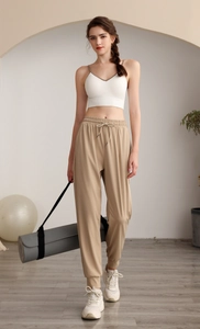 Women's high waist loose jogger set with white sports bra and khaki drawstring sweatpants