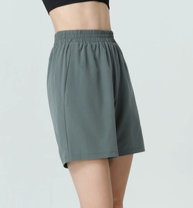 Side view of high-waisted fitness shorts showing pocket detail and elastic waist