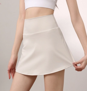Macro detail of ivory high-waisted athletic skort with firm control waistband