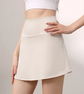 Detailed macro view of the high-waisted elastic cream white tennis skirt athletic fabric