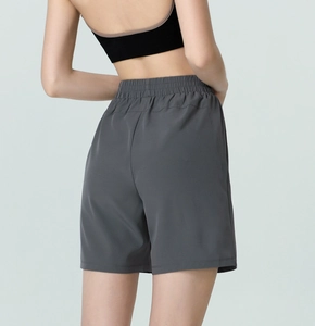 Rear view of high-waist loose sports shorts in dark grey with elastic waistband detail