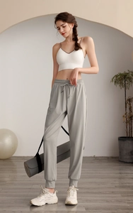 Women's high waist loose nylon joggers featuring drawstring waist and side pockets details