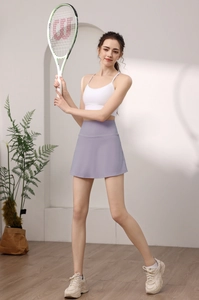 Detail view of high-waist lavender tennis skirt with side pockets and a-line silhouette