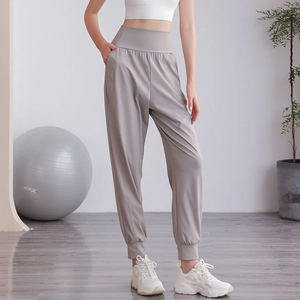 Pantaloni sportivi grigi a vita alta da donna con polsini elastici per yoga e corsa