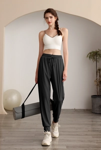 Women's high waist loose fitness joggers with side pockets and a drawstring waist detail