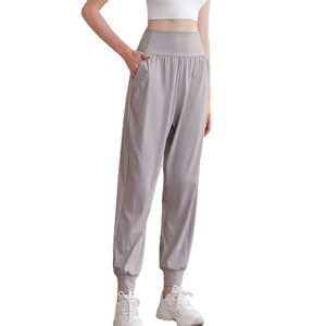Pantaloni sportivi donna a vita alta in nylon con tasche laterali e polsini a costine