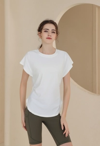 Women's breathable white sports t-shirt showing lightweight fabric and flutter sleeve detail