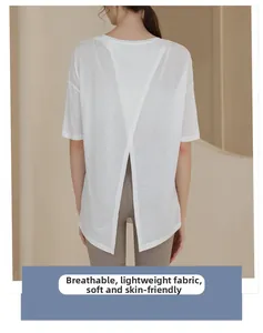 Detail of white breathable workout top for women featuring a stylish cross-back split design