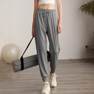 Women's grey high waisted drawstring joggers with pockets for running and yoga fitness
