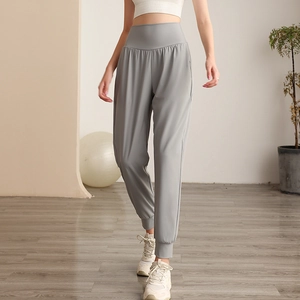 Pantaloni sportivi da donna a vita alta grigio chiaro con polsini elastici per lo yoga