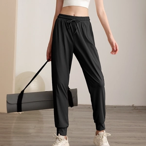 Women's high waist loose nylon sports joggers with pockets and ribbed cuffs in black