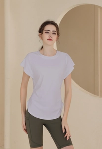 Detail of lavender short sleeve sports top and olive green high waist fitness shorts