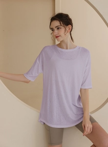Close-up of lightweight light purple oversized sports t-shirt with slub texture fabric