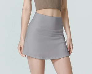 Macro detail of the high-waist band on gray athletic skirt with wide tummy control panel