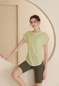 Detail view of breathable lime green sports t-shirt and olive high waist yoga shorts
