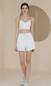 Detail view of nylon sports shorts and V-neck tank top in high-quality breathable fabric