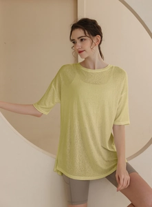 Detail of light yellow breathable t-shirt fabric for yoga and running exercise