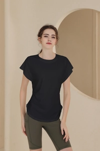 Detail of breathable black sports t-shirt with crew neck and short sleeves for yoga training